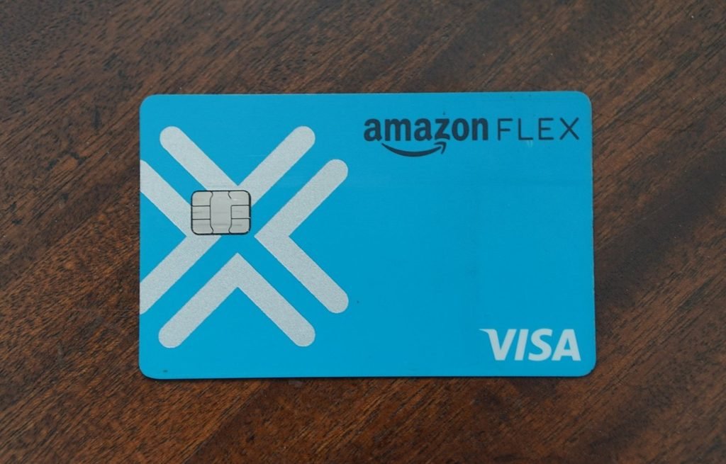 Amazon Flex Debit Card review, blue Visa debit card on a wooden table