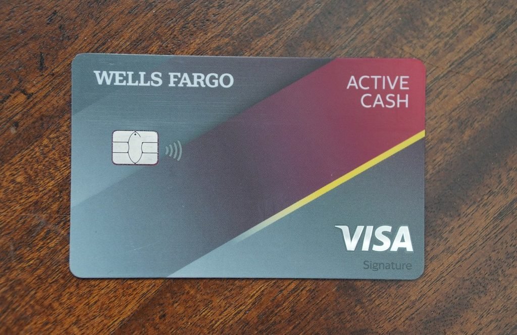 Wells Fargo Active Cash Visa Signature card on a wooden table